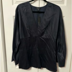 Women’s size large, limited, navy blue suede, silk fitted blouse.